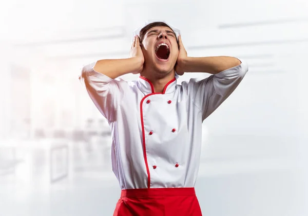 Young male chef screaming in shock and horror — Stock Photo, Image