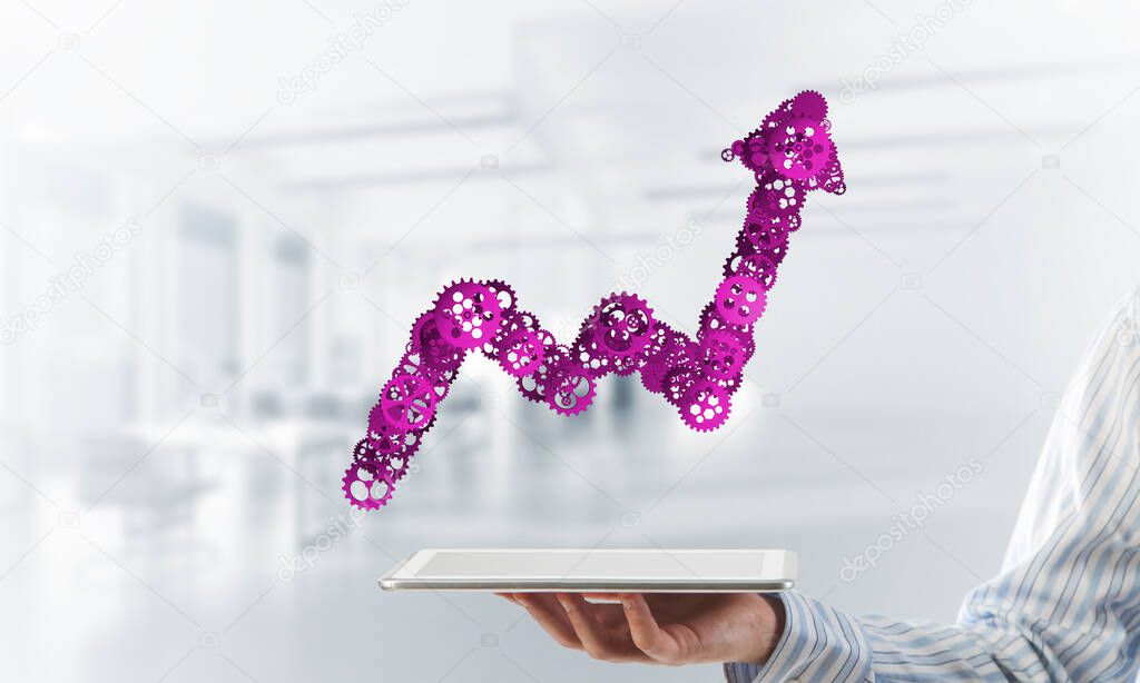 Close of businessman holding tablet pc with progressing graph icon
