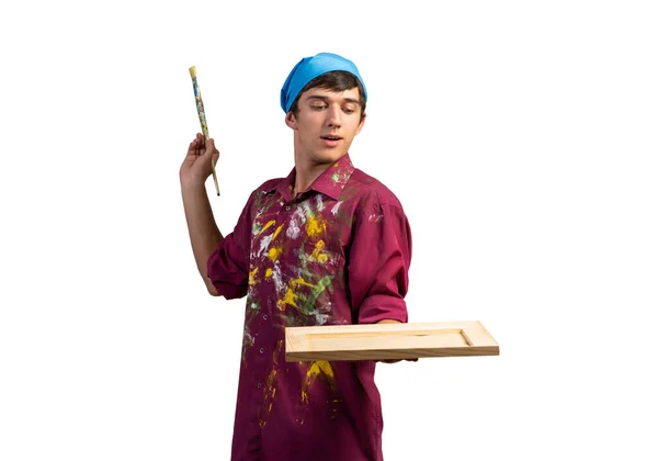 Young handsome painter artist holding paintbrush — Stock Photo, Image