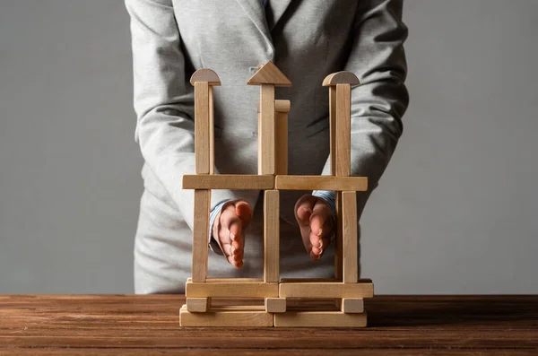 Business woman building construction on table — Stock Photo, Image