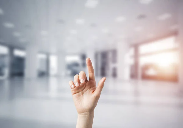 Choosing gesture of person in elegant modern interior in sunshine light — Stock Photo, Image