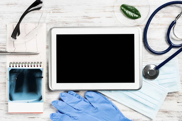 Flat lay workplace of doctor in modern clinic