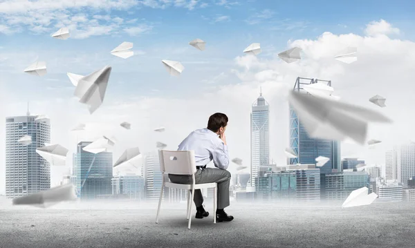 Young businessman sitting on an office chair — Stock Photo, Image