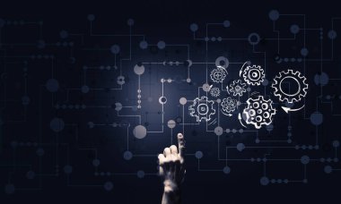 Takım çalışmasının sembolü olarak koyu arkaplanda parlayan dişli mekanizma simgesi