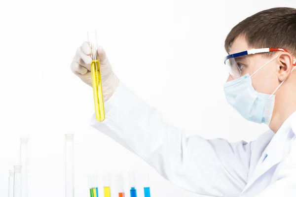 Laboratory technician in safety mask and gloves — Stock Photo, Image