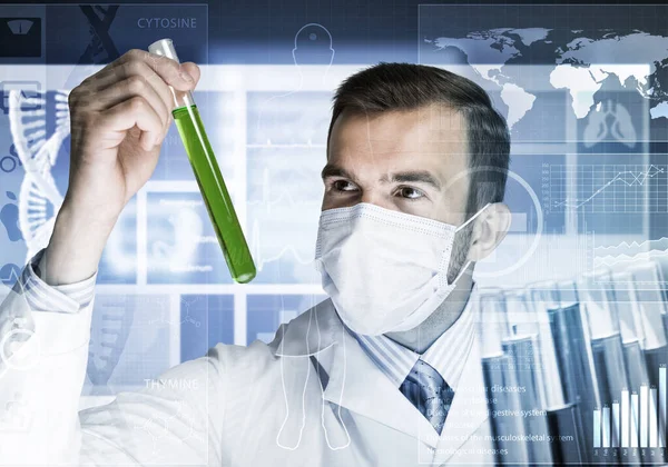 Portrait of concentrated male scientist working with reagents in laboratory — Stock Photo, Image