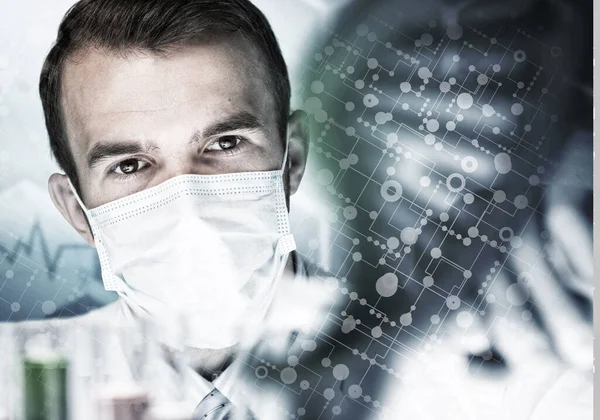 Young scientist mixing reagents in glass flask in clinical laboratory — Stock Photo, Image