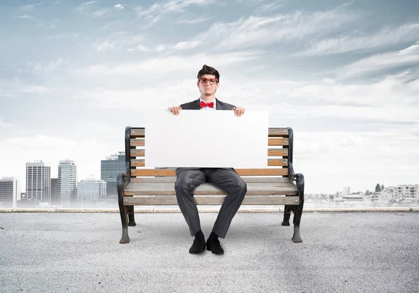 Businessman with an empty banner — Stock Photo, Image