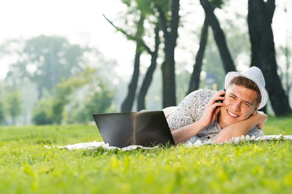 Young man with a cell phone — Stock Photo, Image