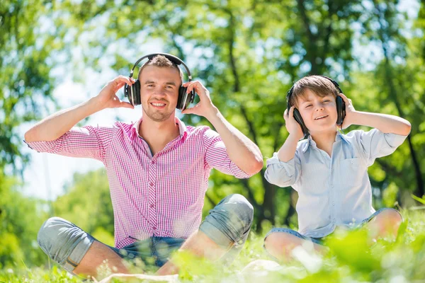 Father and son in park — Stock Photo, Image