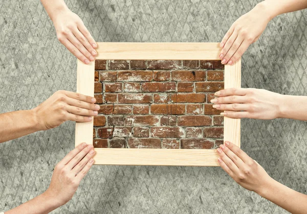 Hands holding frames — Stock Photo, Image