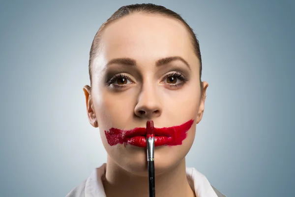 Young woman with vivid red mouth — Stock Photo, Image