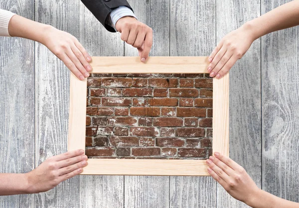 Hands holding frames — Stock Photo, Image