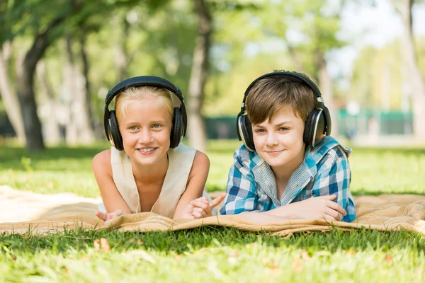 Kids wearing headphones — Stock Photo, Image