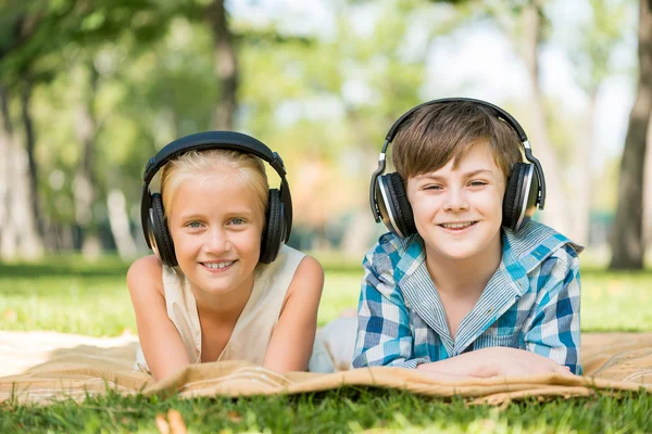 Kids wearing headphones — Stock Photo, Image