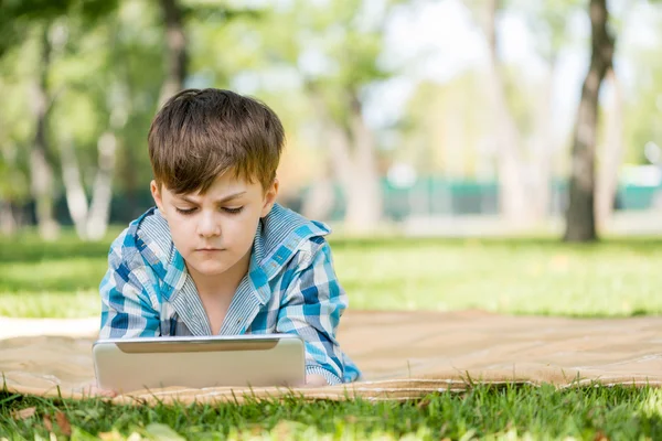 Boy in summer park — Stock Photo, Image