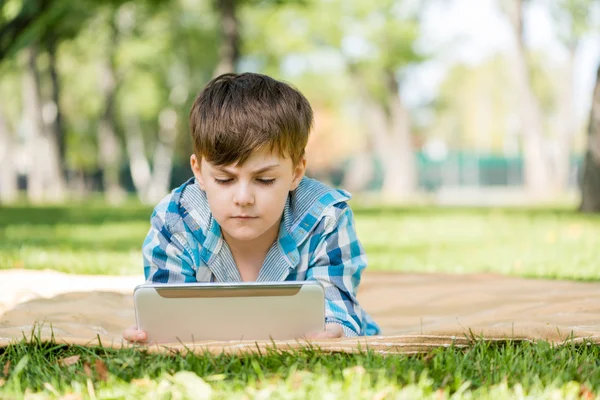 Boy in summer park — Stock Photo, Image