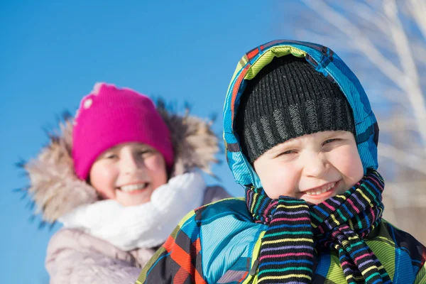 Two cute kids riding sled — Stock Photo, Image