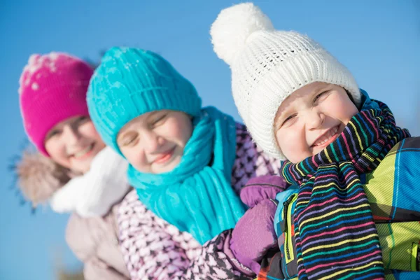 Three happy kids in winter park — Stock Photo, Image