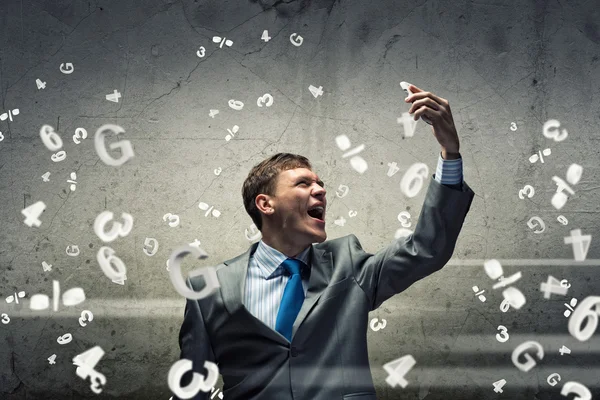 Businessman screaming in mobile phone — Stock Photo, Image