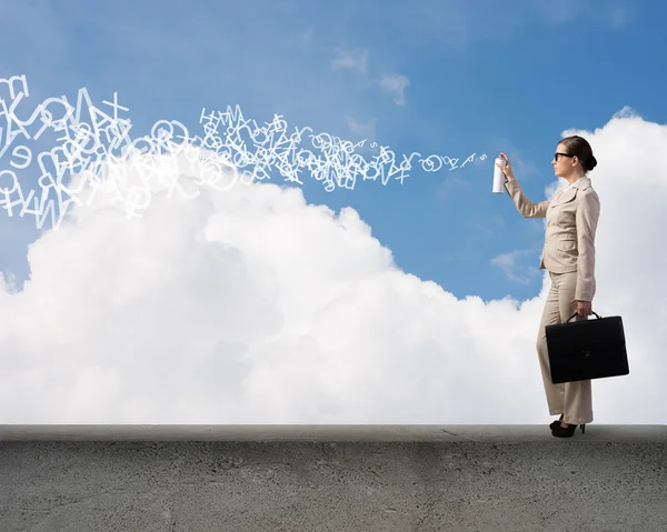 Businesswoman using spray — Stock Photo, Image