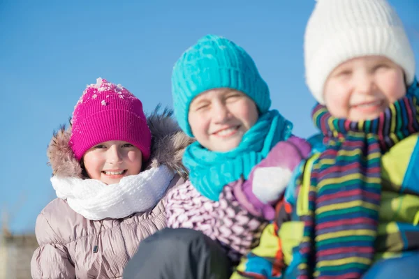 Three happy kids in winter park — Stock Photo, Image