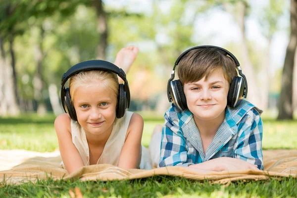 Kids wearing headphones — Stock Photo, Image