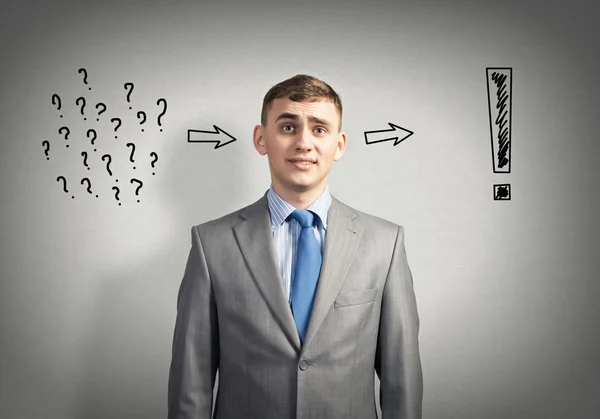 Thoughtful businessman looking in camera — Stock Photo, Image