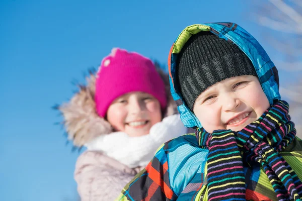 Two cute kids riding sled — Stock Photo, Image