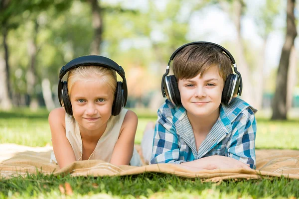 Kids wearing headphones — Stock Photo, Image