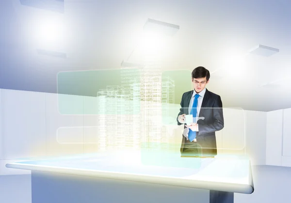 Businessman looking at hologram — Stock Photo, Image