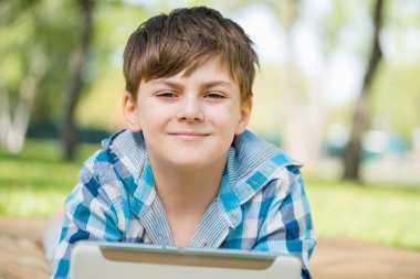 Boy using tablet pc