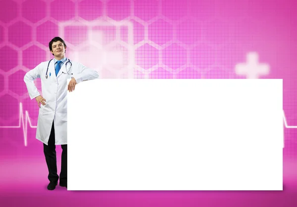 Doctor with banner — Stock Photo, Image