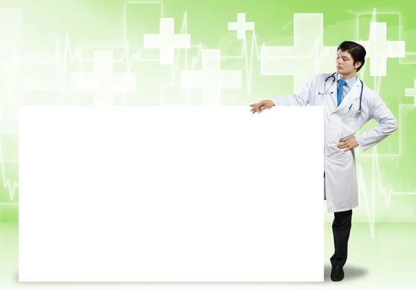 Doctor with banner — Stock Photo, Image