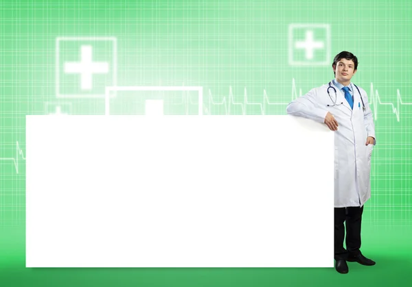 Doctor with banner — Stock Photo, Image