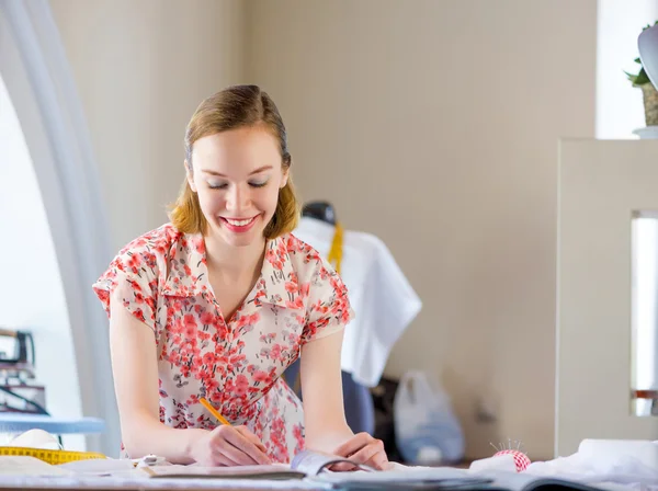 Young pretty needlewoman — Stock Photo, Image