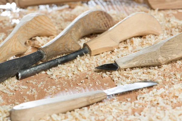 Carpenter's tools lying among sawdust — Stock Photo, Image