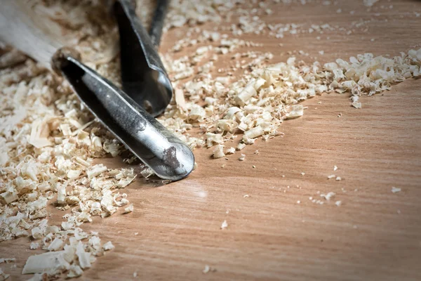 Carpenter's tools lying among sawdust — Stock Photo, Image