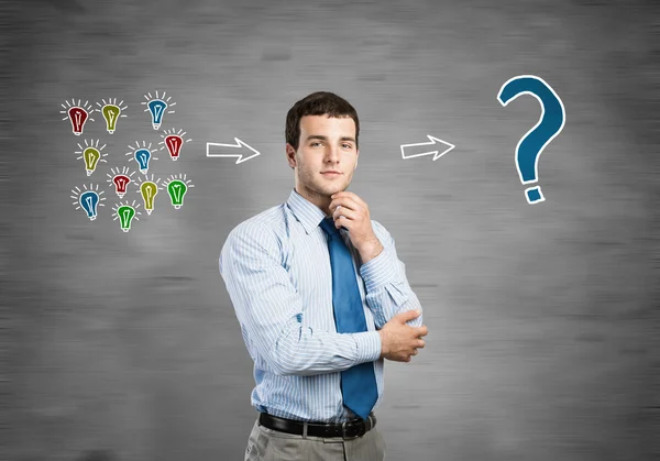 Thoughtful businessman looking in camera — Stock Photo, Image