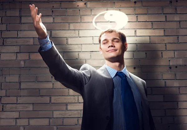 Businessman with symbol above head — Stock Photo, Image