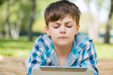 Boy using tablet pc