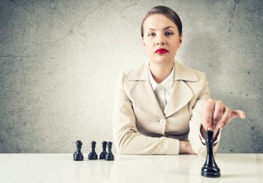 Business woman playing chess clipart