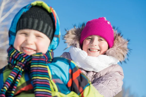 Two cute kids riding sled — Stock Photo, Image