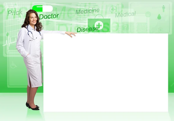 Young woman doctor near blank banner — Stock Photo, Image