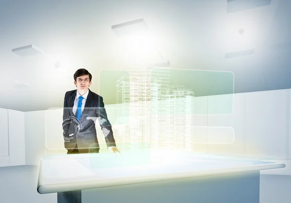 Businessman looking at hologram — Stock Photo, Image