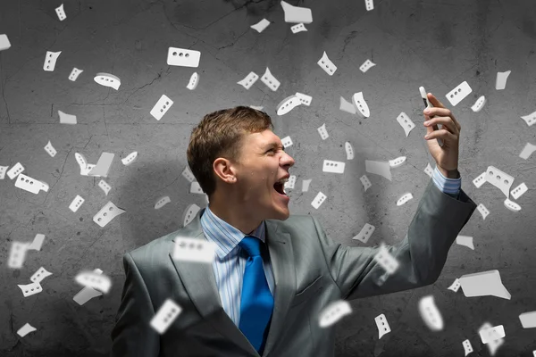 Businessman screaming in mobile phone — Stock Photo, Image