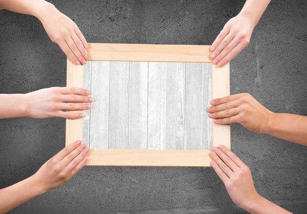 Hands holding frame — Stock Photo, Image