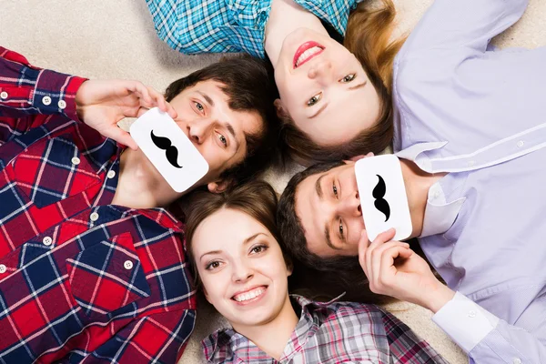 Four people lie together — Stock Photo, Image