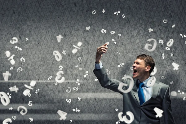 Businessman screaming in mobile phone — Stock Photo, Image