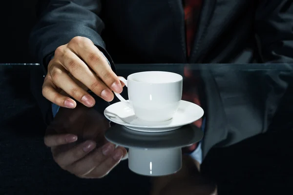 Businessman hand having a cup of coffee — Stock Photo, Image